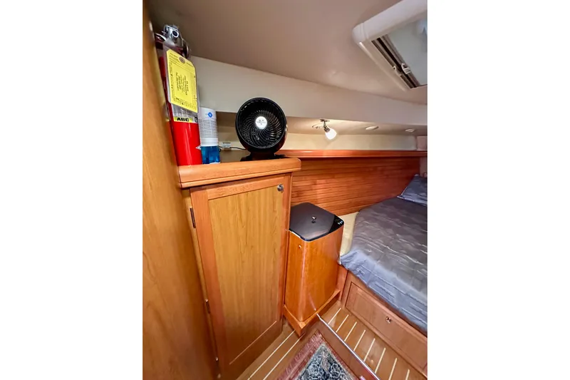 Dasananas Yacht Photos Pics Cozy cabin interior of 2008 Hunter 49 yacht with wooden cabinetry and bed.