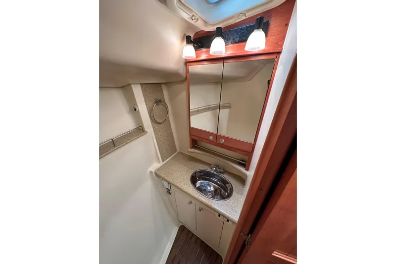 Dasananas Yacht Photos Pics Compact bathroom in 2008 Hunter 49 yacht with mirror, sink, and lighting.