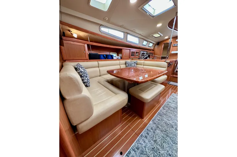 Dasananas Yacht Photos Pics Luxurious interior of 2008 Hunter 49 yacht with elegant seating and wooden finishes.