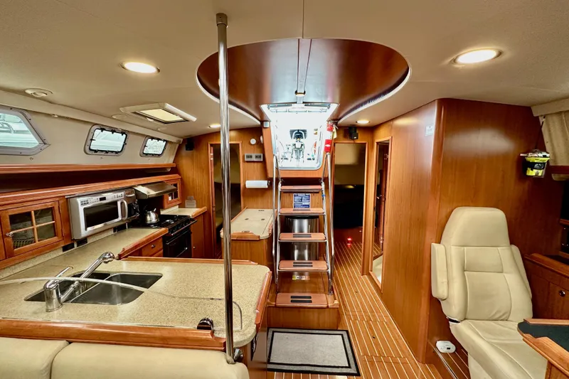 Dasananas Yacht Photos Pics Luxurious interior of 2008 Hunter 49 yacht with modern kitchen and seating area.