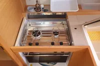 Compact kitchen area in 2020 Dufour 360 Grand Large yacht with stove and storage.