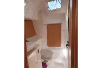 2020 Dufour 360 Grand Large yacht bathroom interior with modern fixtures and wooden accents.