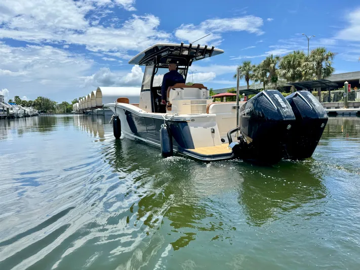  Yacht Photos Pics 2024 Scout 277 LXF boat cruising on a sunny day with clear skies.
