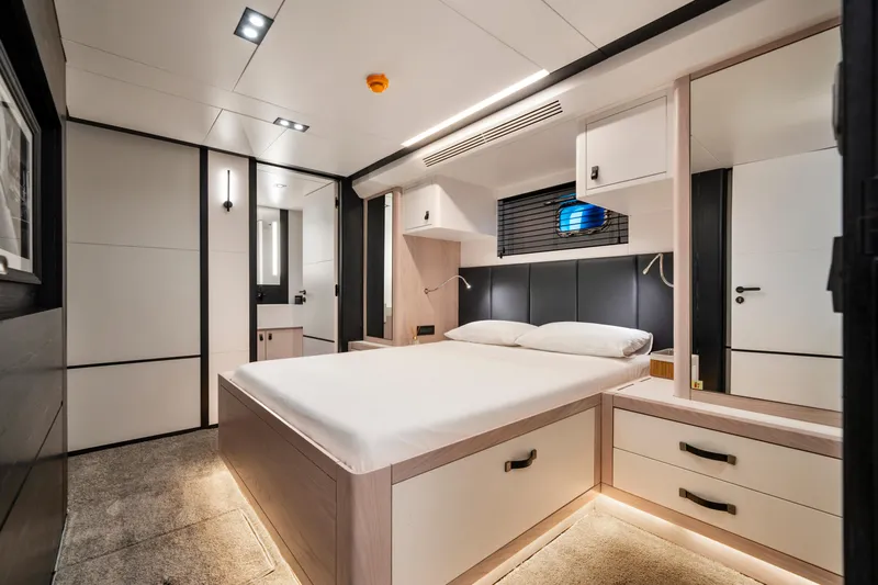 Ice Yacht Photos Pics Luxurious bedroom interior of 2024 Soyaslan 78' yacht with modern design and ambient lighting.