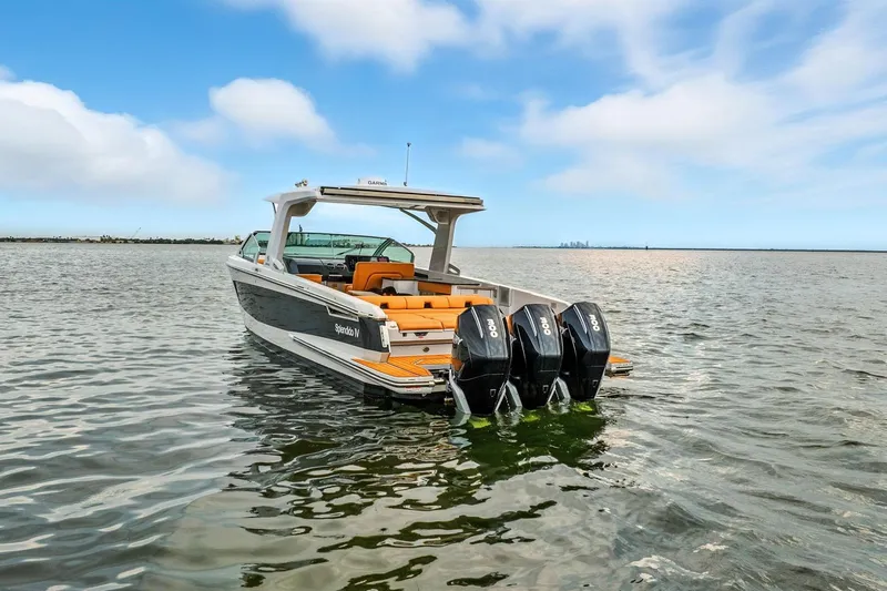  Yacht Photos Pics 2021 Aviara AV36 OB boat with triple outboard engines on open water.