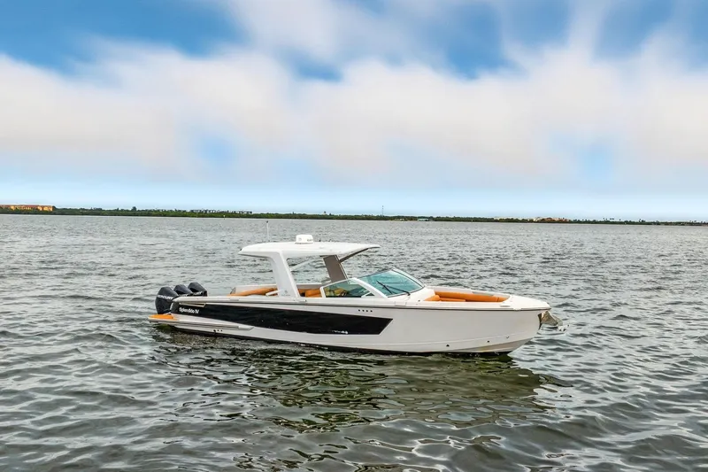  Yacht Photos Pics 2021 Aviara AV36 OB boat on calm water under a blue sky.