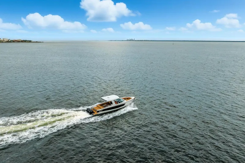  Yacht Photos Pics Aviara AV36 OB 2021 cruising on open water under a clear blue sky.