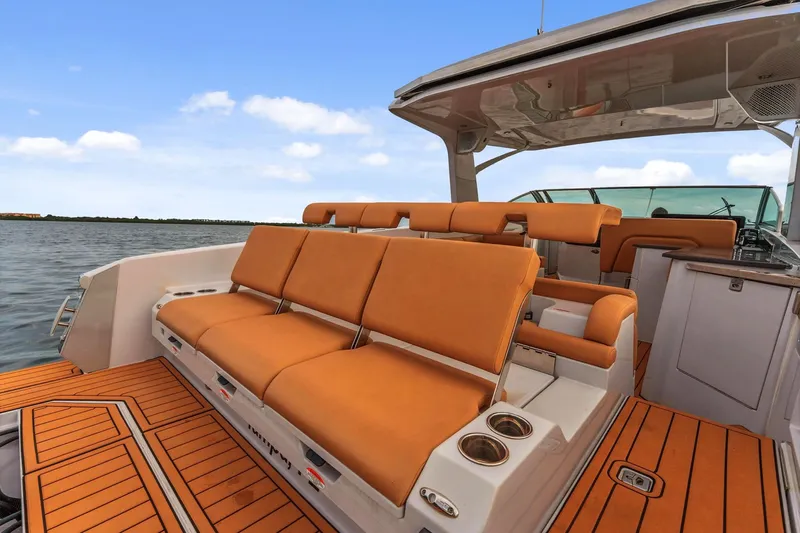  Yacht Photos Pics 2021 Aviara AV36 OB boat with orange seating and teak flooring on open water.