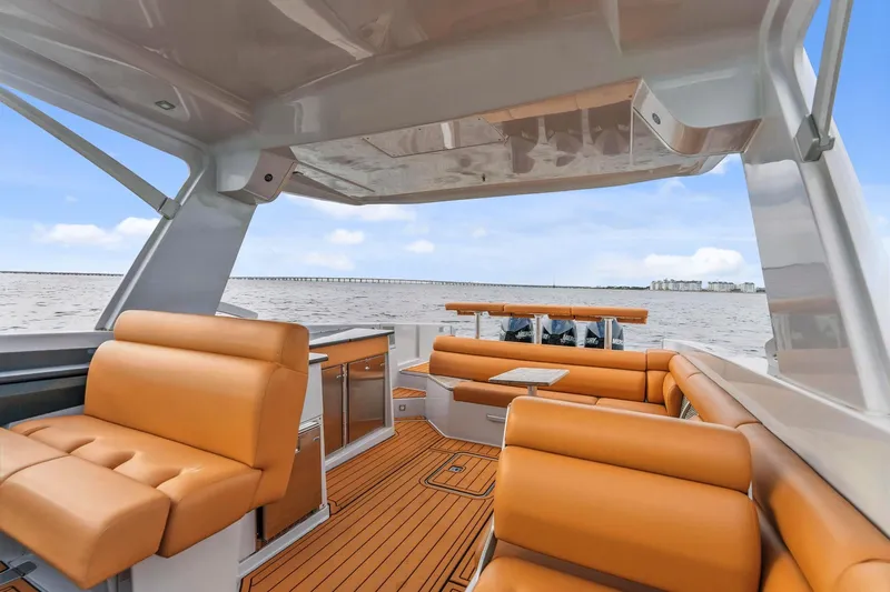  Yacht Photos Pics Luxurious 2021 Aviara AV36 OB boat interior with tan seating and sleek design on open water.