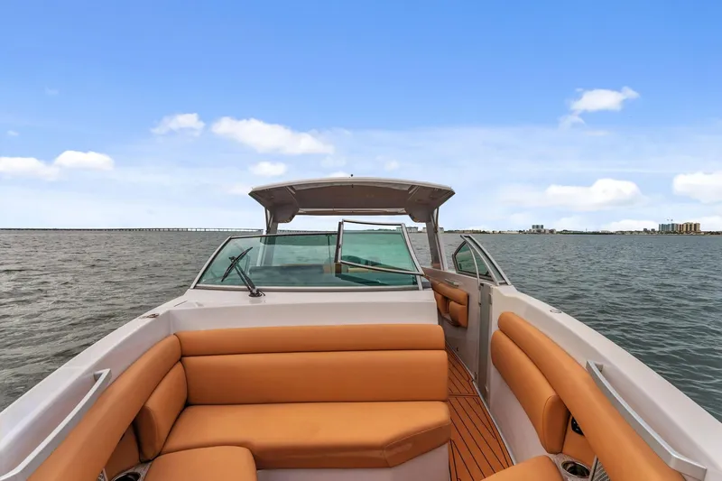  Yacht Photos Pics 2021 Aviara AV36 OB boat with tan seating on open water under blue sky.