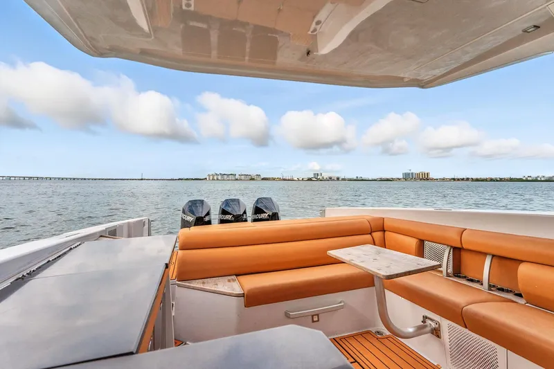  Yacht Photos Pics 2021 Aviara AV36 OB boat with luxurious seating and scenic waterfront view.