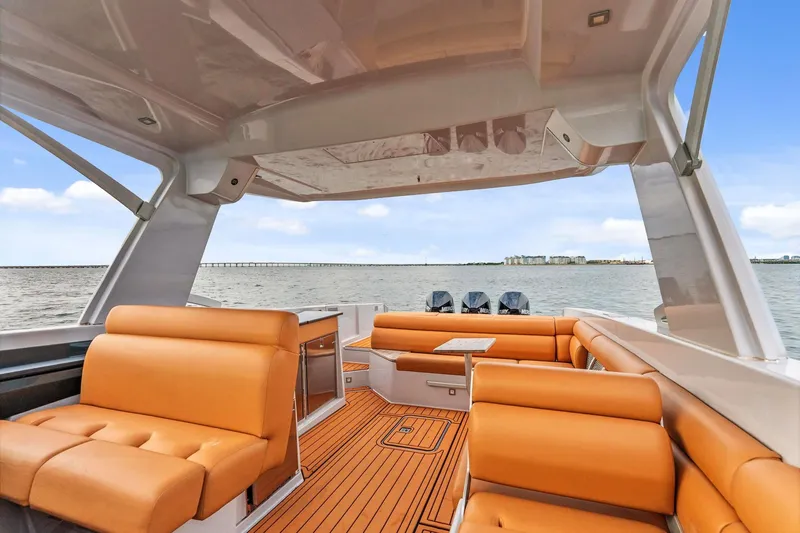  Yacht Photos Pics 2021 Aviara AV36 OB luxury boat interior with tan seating and scenic water view.