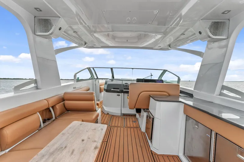  Yacht Photos Pics 2021 Aviara AV36 OB boat interior with tan seating and modern helm.