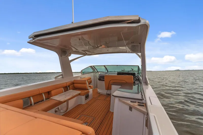  Yacht Photos Pics 2021 Aviara AV36 OB boat interior with tan seating and open water view.
