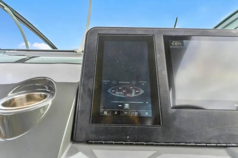 Yacht Photos Pics Control panel of 2021 Aviara AV36 OB boat with digital display and cup holder.