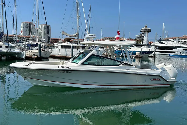 2023 Boston Whaler 280 Vantage @ Puerto Vallarta Yacht Photos Pics 2023 Boston Whaler 280 Vantage boat docked in a marina, clear blue sky.