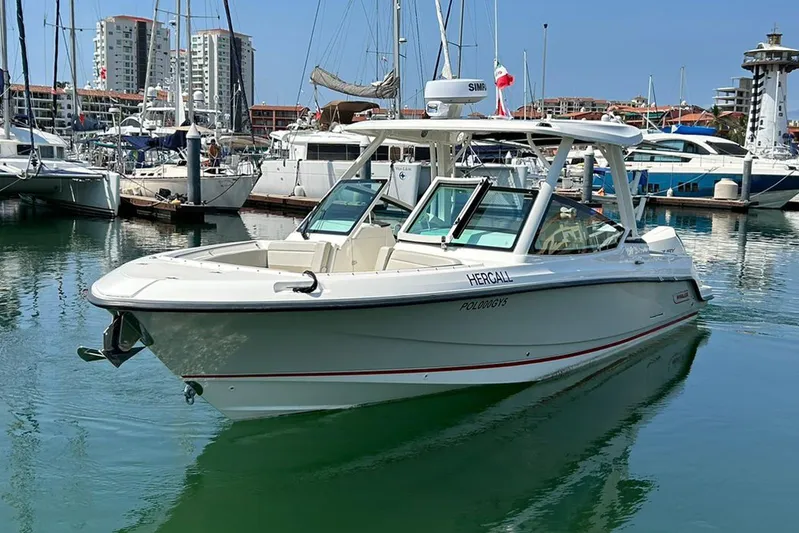 2023 Boston Whaler 280 Vantage @ Puerto Vallarta Yacht Photos Pics 2023 Boston Whaler 280 Vantage boat docked in a marina with other vessels.