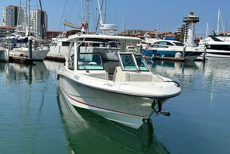 2023 Boston Whaler 280 Vantage @ Puerto Vallarta Yacht Photos Pics 2023 Boston Whaler 280 Vantage boat docked in a marina with other vessels.