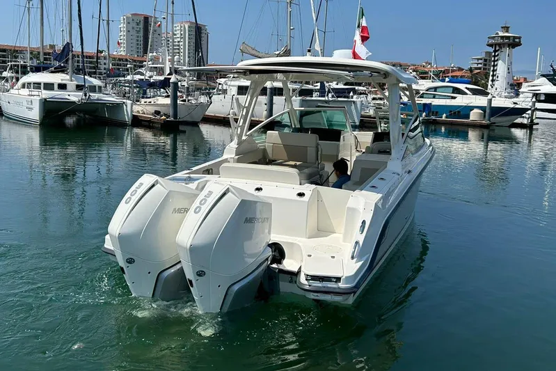 2023 Boston Whaler 280 Vantage @ Puerto Vallarta Yacht Photos Pics 2023 Boston Whaler 280 Vantage boat docked in a marina with twin Mercury engines.