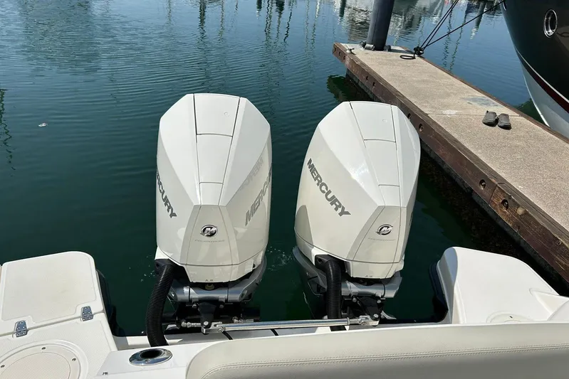 2023 Boston Whaler 280 Vantage @ Puerto Vallarta Yacht Photos Pics Twin Mercury outboard engines on a 2023 Boston Whaler 280 Vantage at a marina.