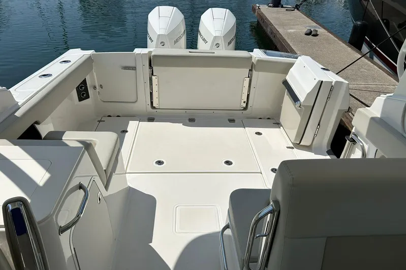 2023 Boston Whaler 280 Vantage @ Puerto Vallarta Yacht Photos Pics 2023 Boston Whaler 280 Vantage boat interior with dual Mercury engines at dock.