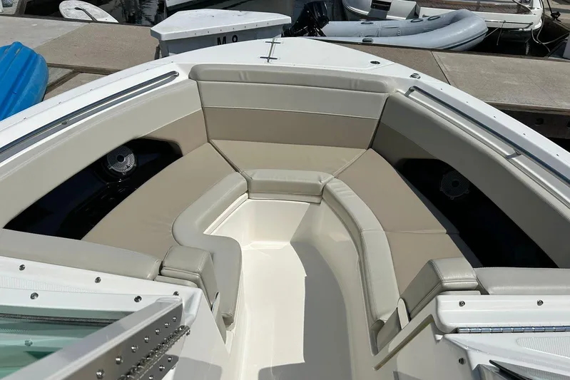 2023 Boston Whaler 280 Vantage @ Puerto Vallarta Yacht Photos Pics 2023 Boston Whaler 280 Vantage boat interior with beige seating at dock.