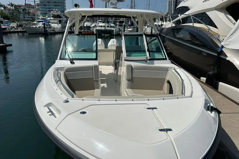 2023 Boston Whaler 280 Vantage @ Puerto Vallarta Yacht Photos Pics 2023 Boston Whaler 280 Vantage boat docked in marina, showcasing sleek design.