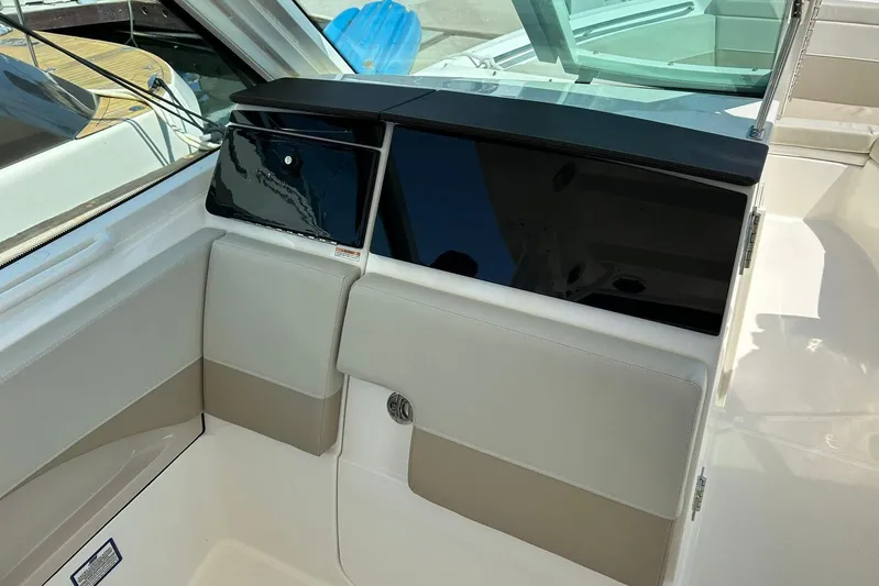 2023 Boston Whaler 280 Vantage @ Puerto Vallarta Yacht Photos Pics 2023 Boston Whaler 280 Vantage interior with sleek seating and storage compartments.
