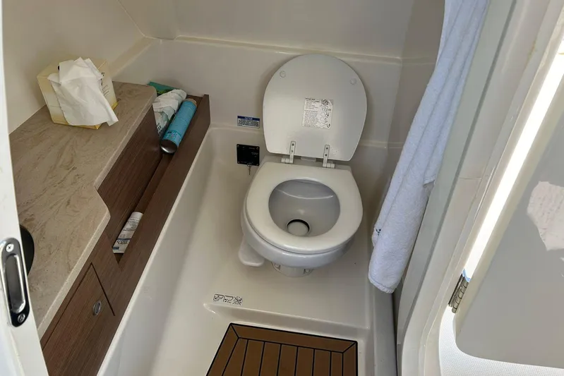 2023 Boston Whaler 280 Vantage @ Puerto Vallarta Yacht Photos Pics 2023 Boston Whaler 280 Vantage boat bathroom with toilet and storage.