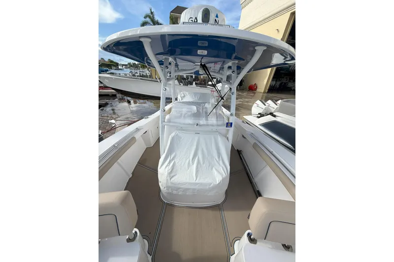 Chasing Palooza Yacht Photos Pics 2024 Southport 30 FE boat interior with covered console and seating.