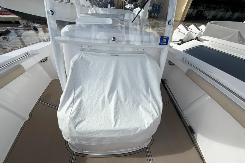 Chasing Palooza Yacht Photos Pics 2024 Southport 30 FE boat interior with covered console and seating.