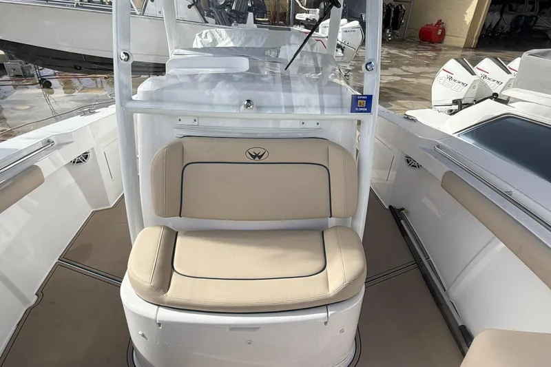 Chasing Palooza Yacht Photos Pics 2024 Southport 30 FE boat interior with beige seating and modern design.