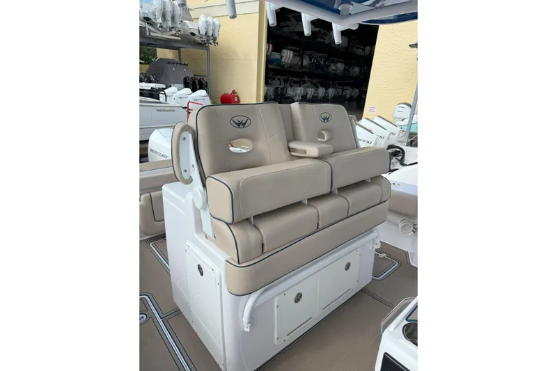 Chasing Palooza Yacht Photos Pics 2024 Southport 30 FE boat seating with beige cushions and storage compartments.