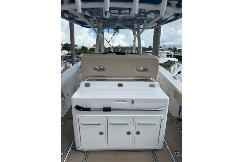 Chasing Palooza Yacht Photos Pics 2024 Southport 30 FE boat interior with seating and storage compartments.