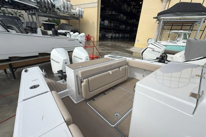 Chasing Palooza Yacht Photos Pics 2024 Southport 30 FE boat interior with Mercury engines, docked in a marina.