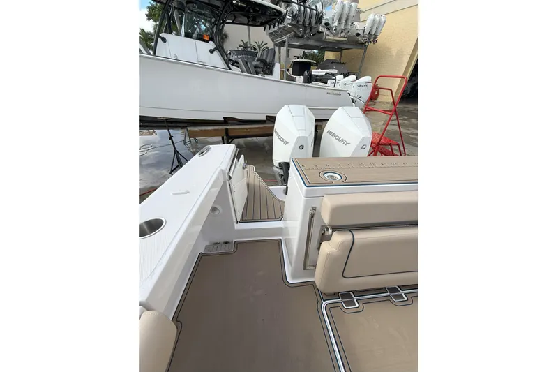 Chasing Palooza Yacht Photos Pics 2024 Southport 30 FE boat with dual Mercury engines, featuring spacious deck and seating.