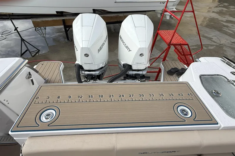 Chasing Palooza Yacht Photos Pics 2024 Southport 30 FE boat with dual Mercury engines and measuring board.