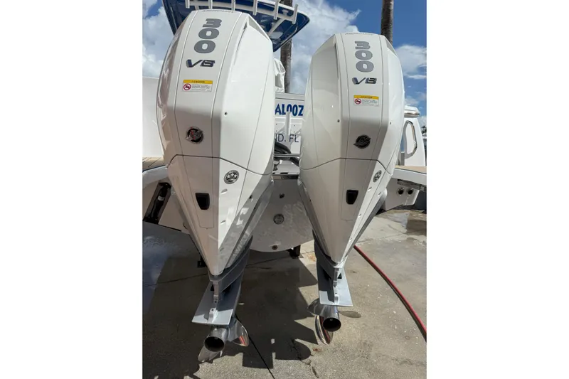 Chasing Palooza Yacht Photos Pics 2024 Southport 30 FE boat with dual 300 V8 engines, docked under a clear sky.