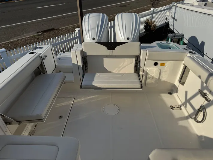  Yacht Photos Pics 2024 Sailfish 276 DC boat deck with seating and dual engines.