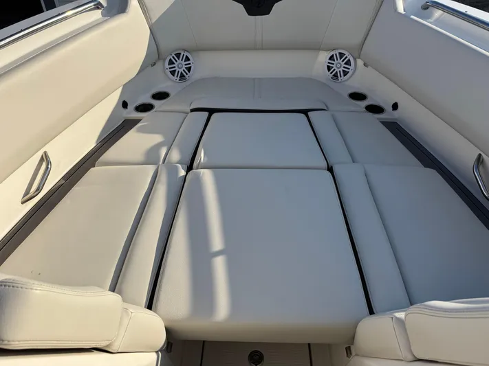  Yacht Photos Pics 2024 Sailfish 276 DC boat interior with cushioned seating and built-in speakers.