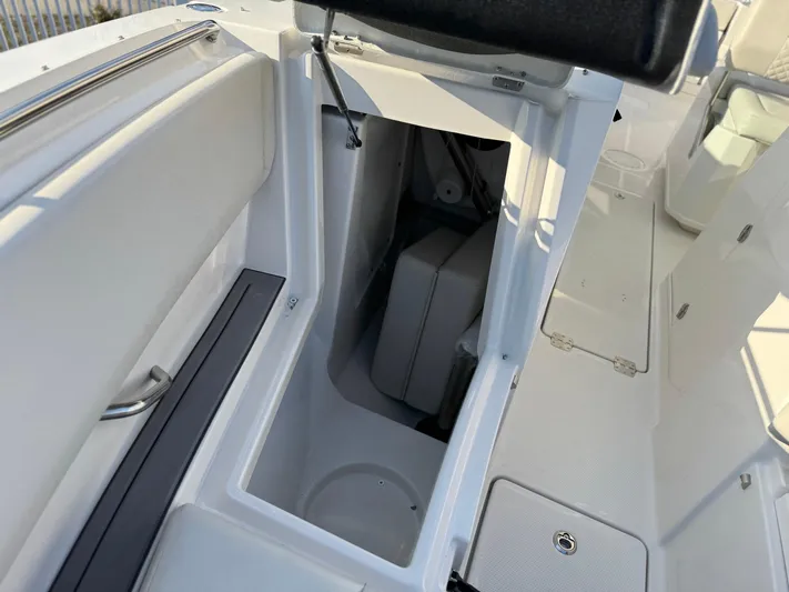  Yacht Photos Pics 2024 Sailfish 276 DC boat interior storage compartment, open and spacious design.