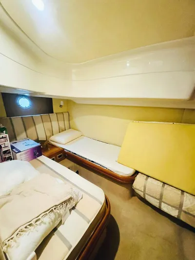  Yacht Photos Pics 2006 Cranchi Mediterranee 47 cabin interior with twin beds and cozy decor.