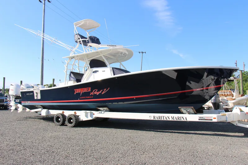  Yacht Photos Pics 2016 Regulator 41 boat on trailer at Raritan Marina, clear sky background.