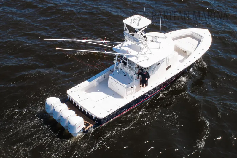  Yacht Photos Pics 2016 Regulator 41 boat cruising on open water with multiple outboard engines.