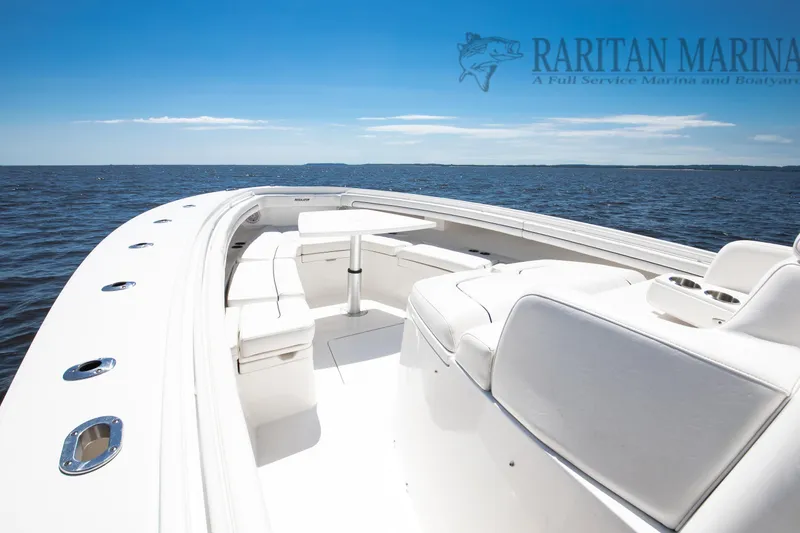  Yacht Photos Pics 2016 Regulator 41 boat with white seating, table, and ocean view.