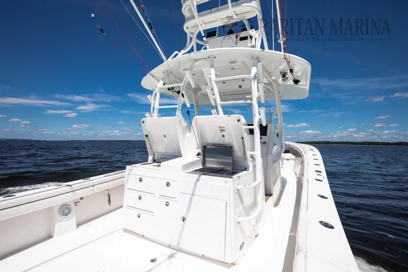  Yacht Photos Pics 2016 Regulator 41 boat on open water, featuring sleek design and fishing equipment.