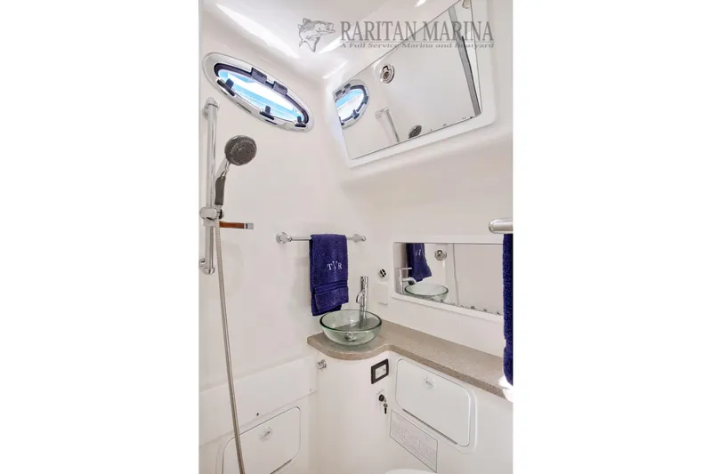  Yacht Photos Pics Luxurious bathroom in 2016 Regulator 41 boat with modern fixtures and elegant design.