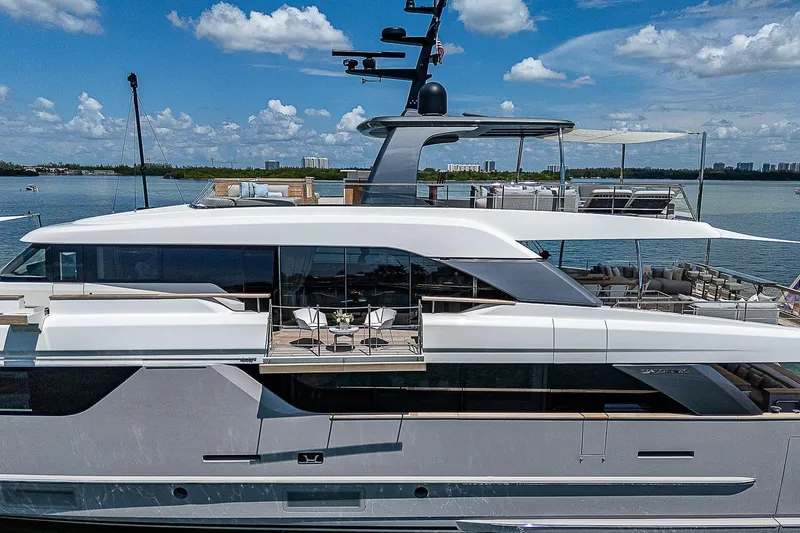 The Wolf Yacht Photos Pics Luxurious 2023 Sanlorenzo SD118 yacht with modern design, docked on a sunny day.