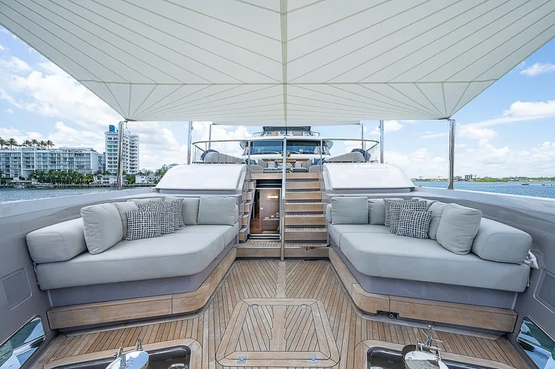 The Wolf Yacht Photos Pics Luxurious 2023 Sanlorenzo SD118 yacht deck with elegant seating and canopy.