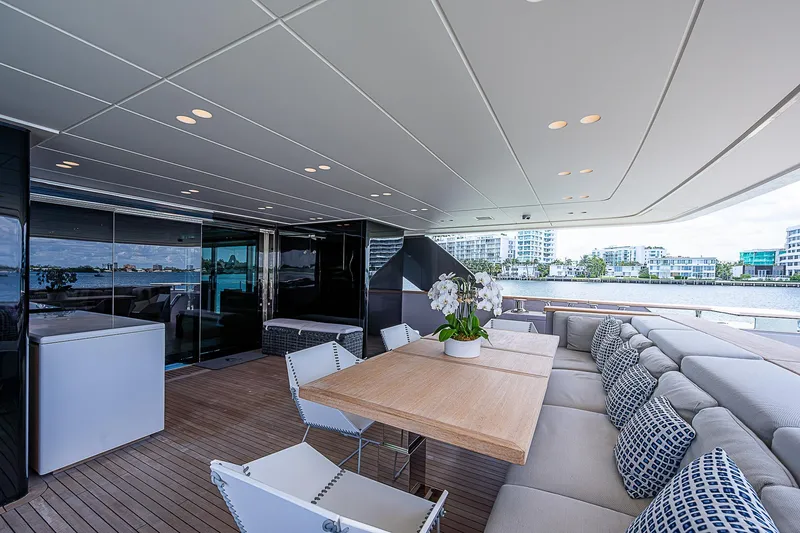 The Wolf Yacht Photos Pics Luxurious 2023 Sanlorenzo SD118 yacht deck with elegant seating and dining area.